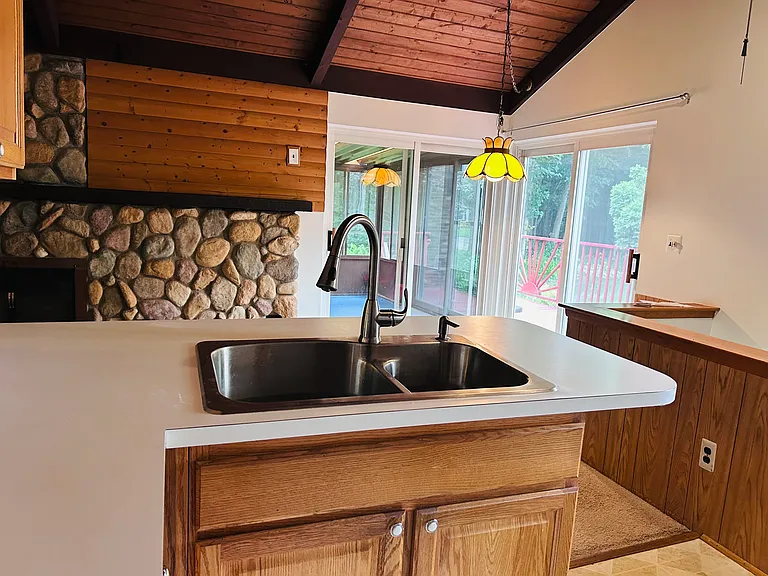 Kitchen view to sunroom and deck