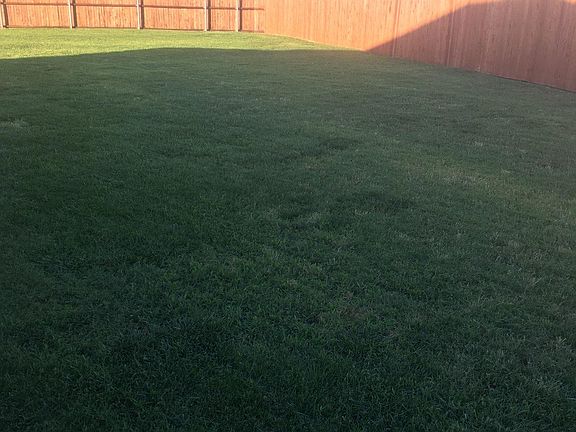 Large fenced yard with new fencing - yard is larger than this pix