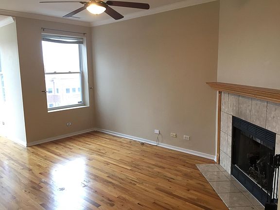 Living Room with Fireplace and Ceiling Fan