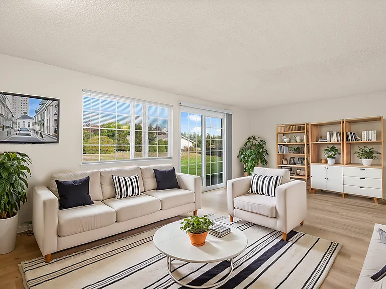 Step into a sunlit living space with modern furnishings and garden views. Step into a sunlit living space with modern furnishings and garden views.