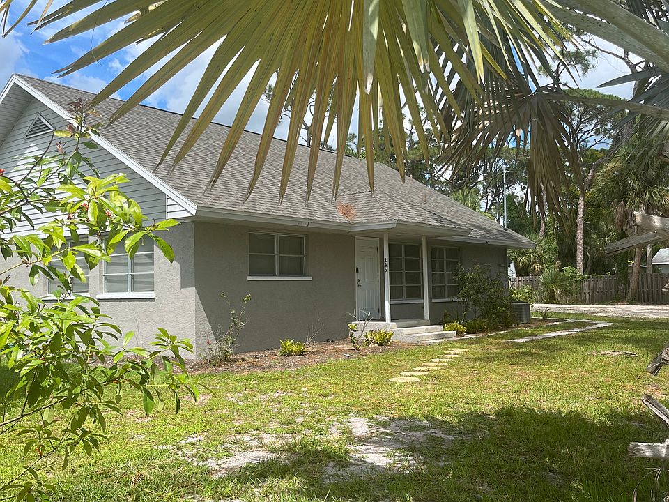 Home on a large lot with lots of pine trees