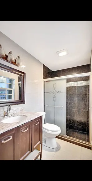 Renovated Master bathroom with shower and spacious vanity storage