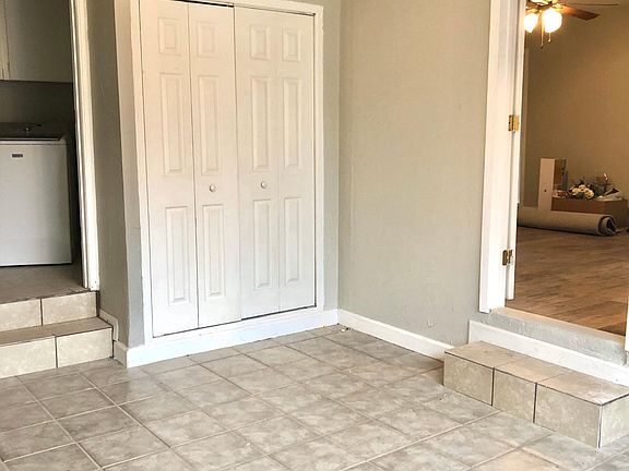 Front bedroom with laundry room & half bath. New light fixture. New paint.
