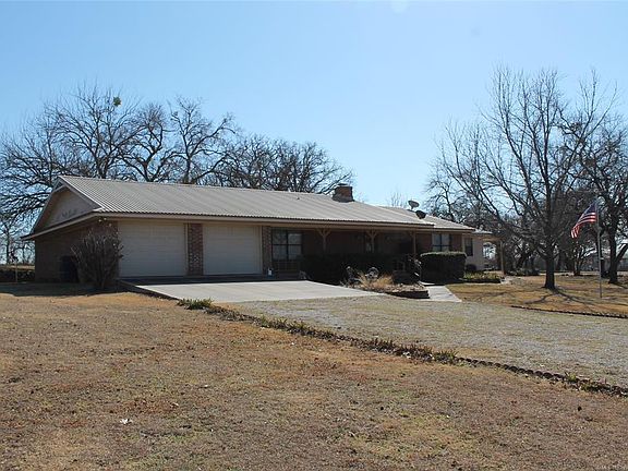 Image 2: Front with long driveway