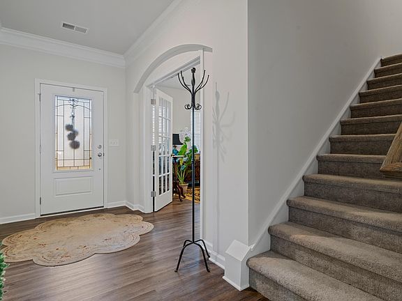 Double french doors to office and stairs to 2nd floor
