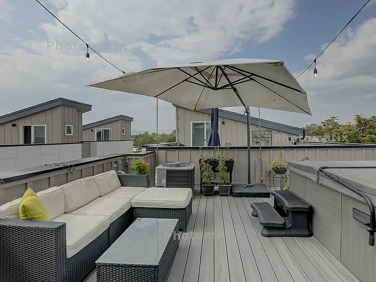Large roof deck, shown with owner furniture /fixtures to be removed (4th floor)