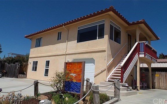 Upstairs serviced by staircase, lower unit accessed on street level.