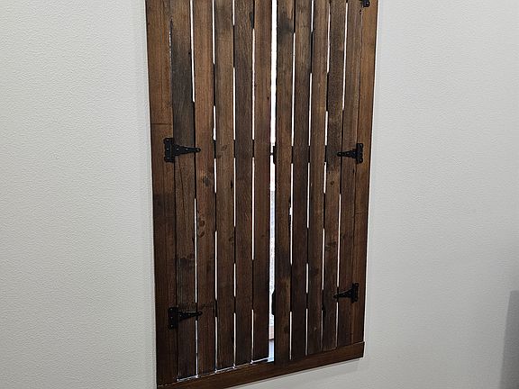 Hand-made shutters from reclaimed lumber.