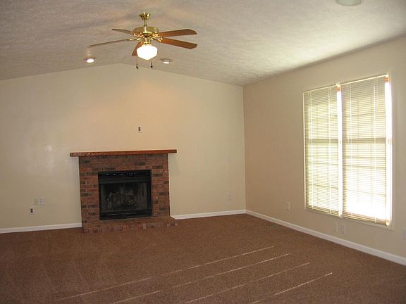 Family rm with cathedral ceiling & fireplace.