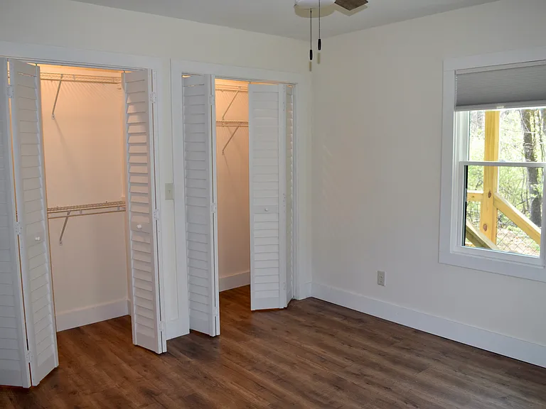 Main bedroom, double closets with 2 clothes racks each