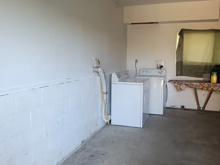 Storage space and laundry area in Garage