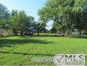 Side yard along Blacktop