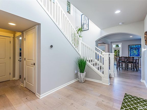 Just off the entrance is a bedroom, full bath and stairs to the finished, walk-out basement