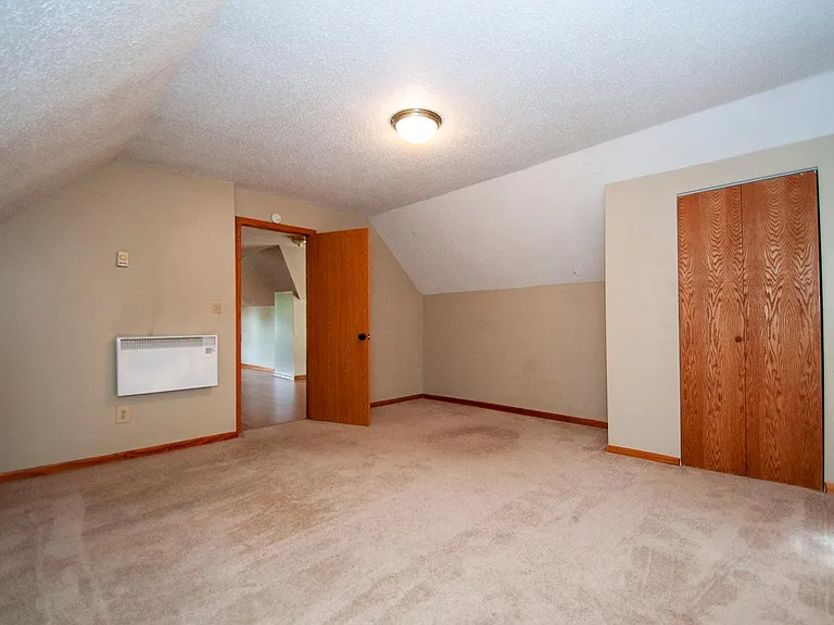 There is new carpet in this bedroom.
