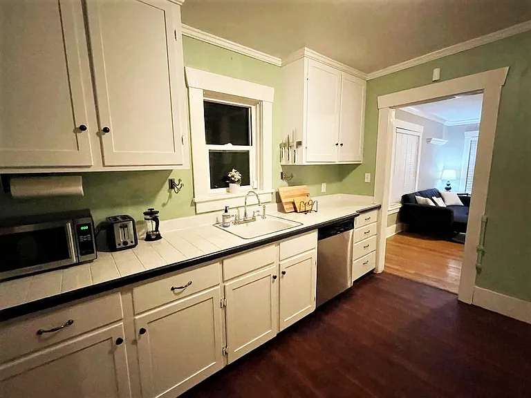 Kitchen looking into living room