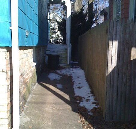 Alley on right side of house stairs go to kitchen door