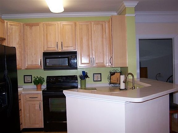 42" Maple Cabinets - solid surface counters