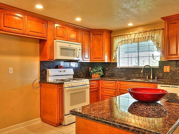 Kitchen with Granite Slab Counters