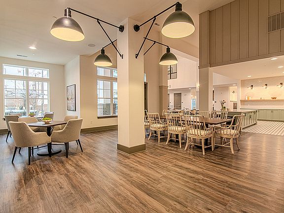 Experience open-concept living with this elegant dining area, perfect for gatherings.