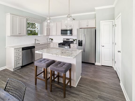 Enjoy cooking meals in the Aspire kitchen with stainless steel appliances