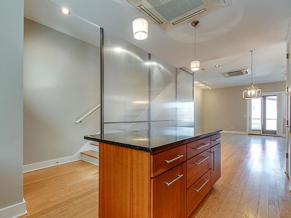 Additional picture of your kitchen with view of stairs to your top floor.