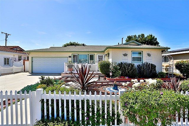 Beautiful curb appeal new roof, concrete driveway, front porch, meticulously landscaped with flower 