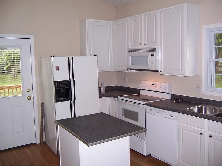 A new fridge has been installed since photo was taken.