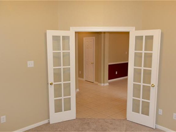 DOUBLED FRENCH DOORS LEADING INTO THE STUDY