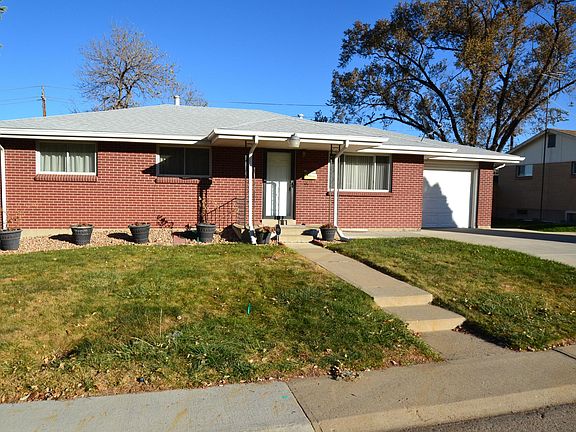 Front exterior with covered porch, 1-car attached garage and extra off-street parking