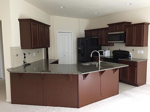 Kitchen area with pantry closet.