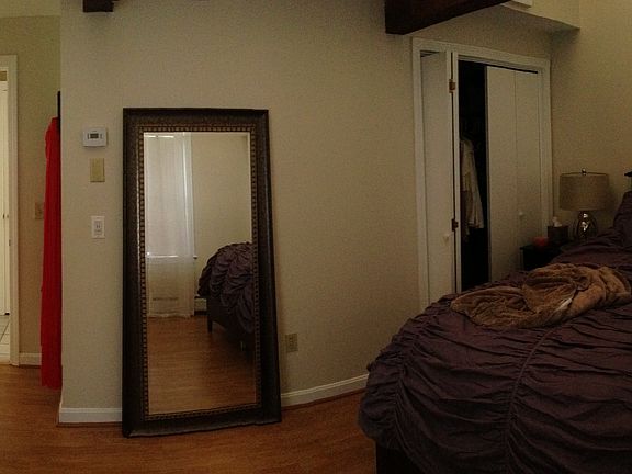 Master bedroom with stairs to loft