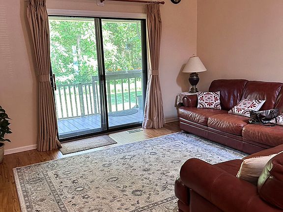 Living room has sliding door to back yard and deck.