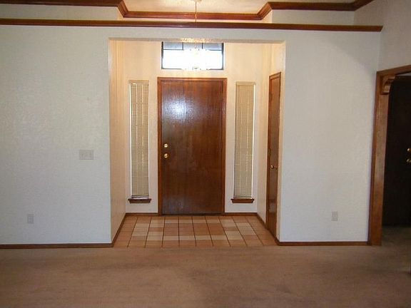 Tiled entry way w/ coat closet and quality wood work