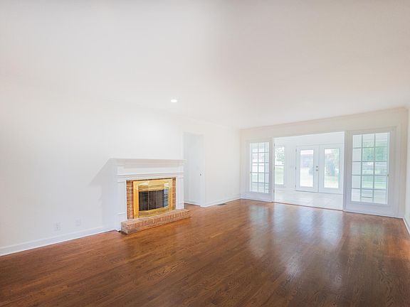 Livingroom with gas fireplace and sunroom