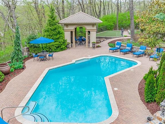 Saltwater Pool, Cabana, Putting Green amongst Lush Landscape
