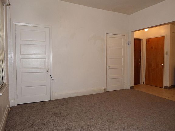 Living Room - looking back into hallway near apartment door and kitchen