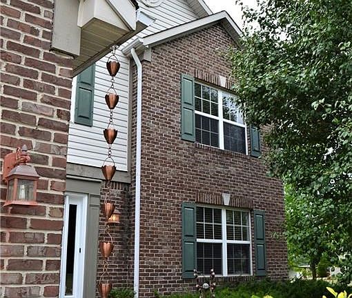 Nicely landscaped with mature trees for shade & privacy. Brick enhancements to front add appeal.
