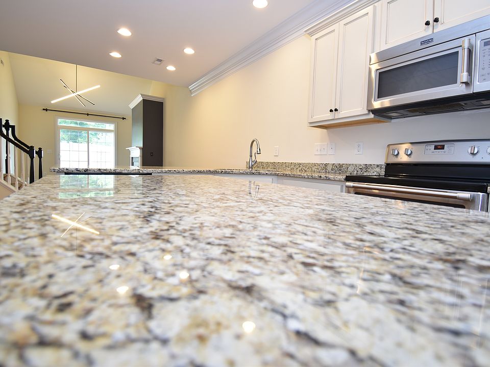 This granite island is amazing. Be a part of the conversation thanks to this homes open concept layout.