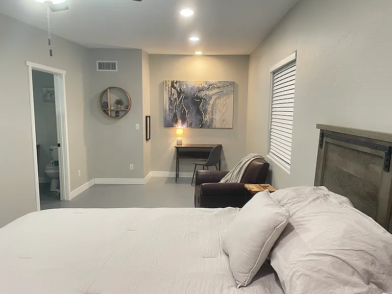 Primary bedroom with desk