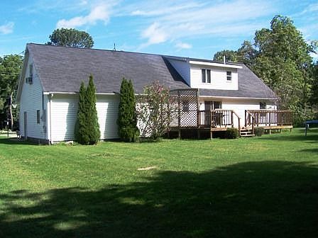 Spacious backyard with deck to entertain