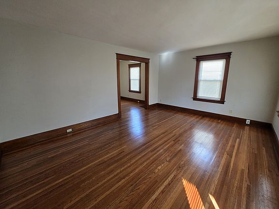Living room with tall ceilings and Hw Floors