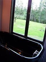 hidden bathroom with soaking tub