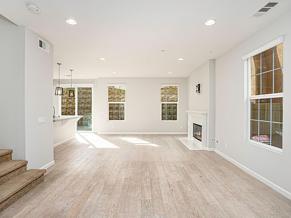 Entry- Features Hallway closet, half bath downstairs, access to garage