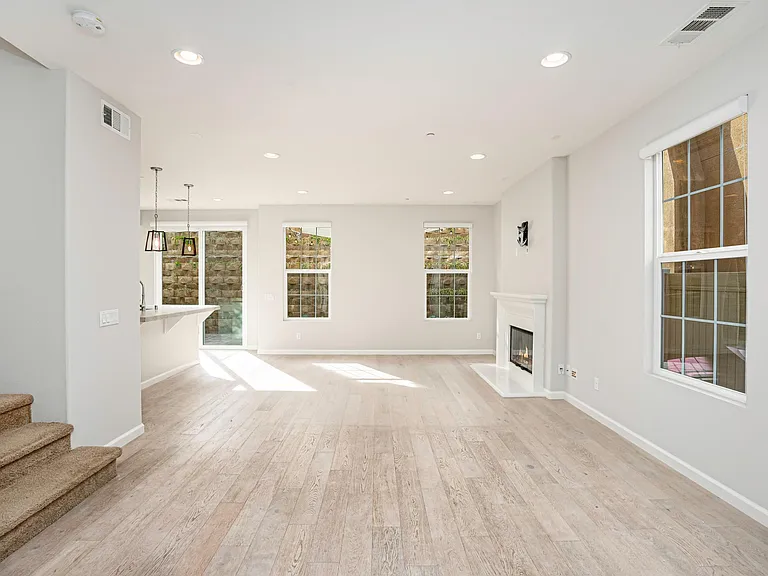 Entry- Features Hallway closet, half bath downstairs, access to garage