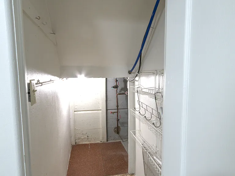 Pantry space off kitchen - also some extra storage with low ceiling