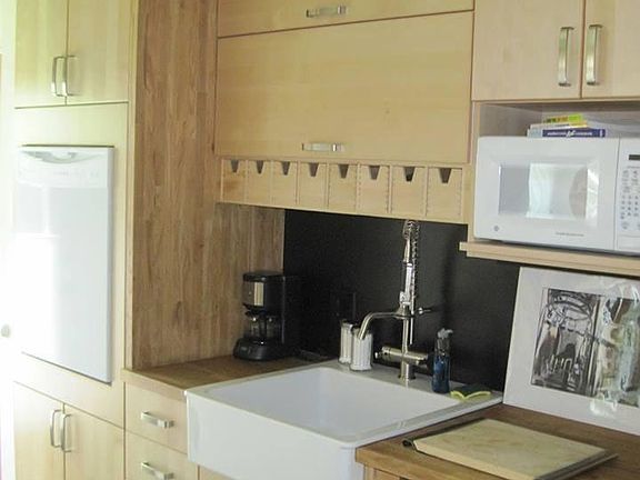 Deep farm kitchen sink, ergonomically placed dishwasher (no lower back pain required to load dishes). Just past the D/W is a new stackable washer & dryer.