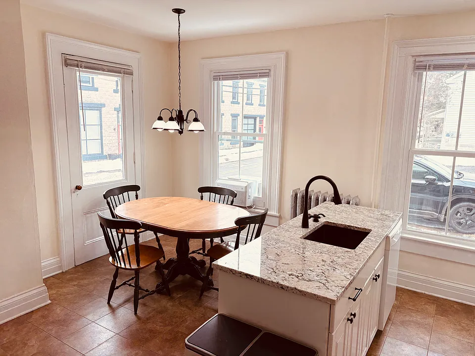 Refinished kitchen with granite, updated appliances, and fixtures.