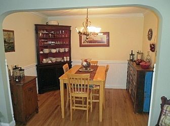 Hardwood floors in dining rm. w/chair rail & crown