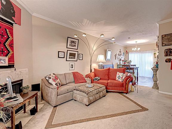 Large living room with corner fireplace.