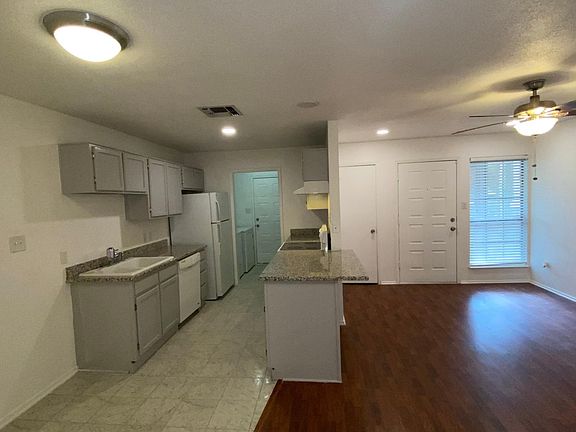 View of Kitchen, Living Area from Dining Area/ Breakfast Nook.